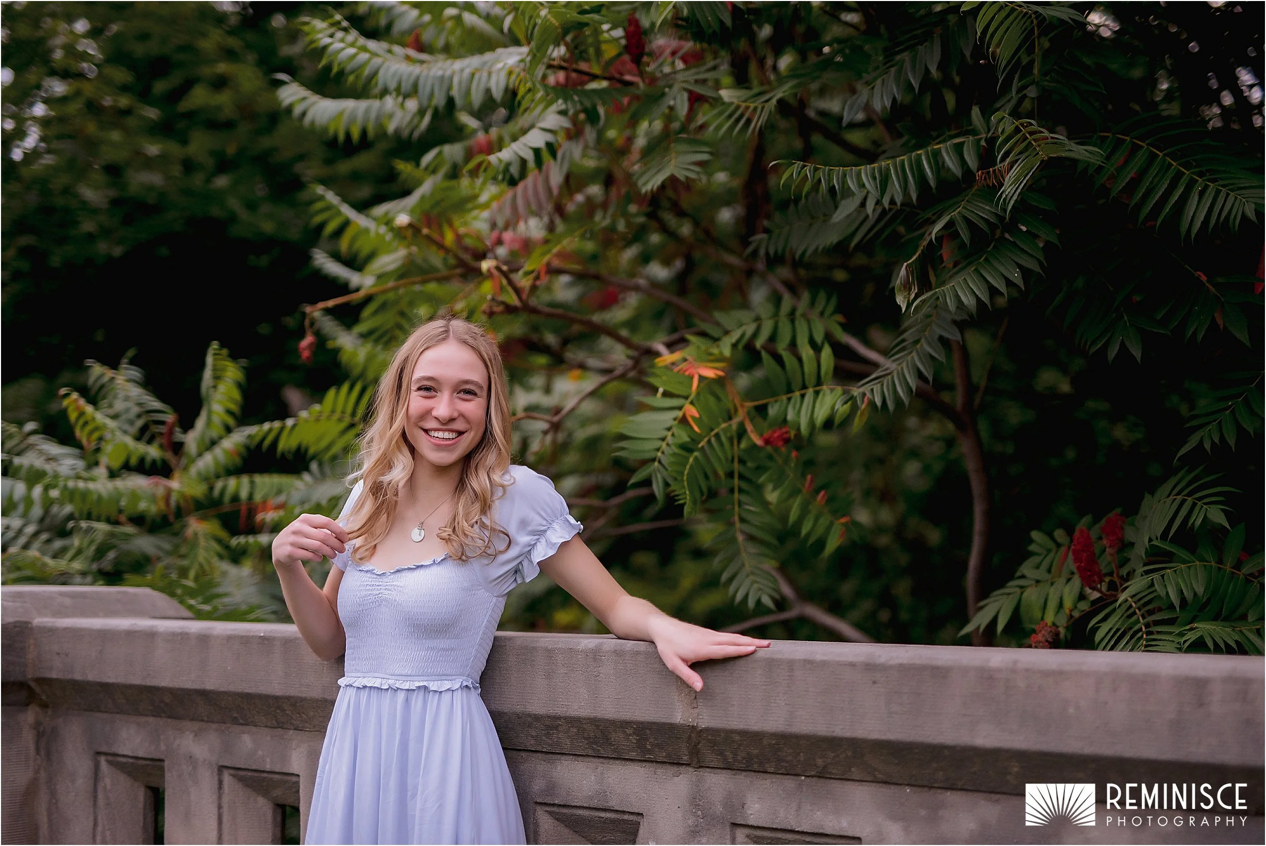 06-girl-touching-hair-back-against-stone-wall-greenery-background.JPG