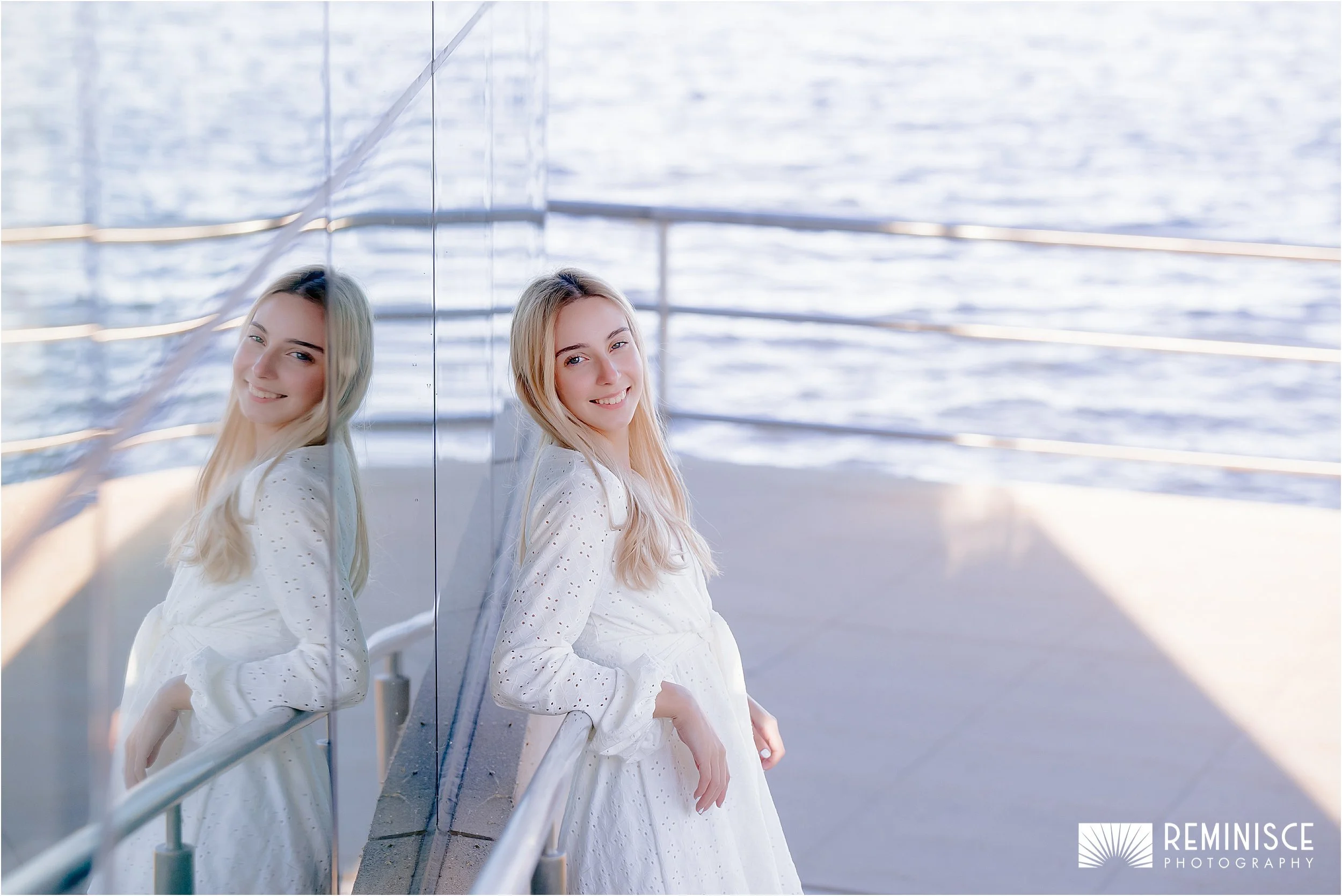 03-girl-leaning-elbow-silver-rail-reflection-glass-window-baby-blue-water.JPG