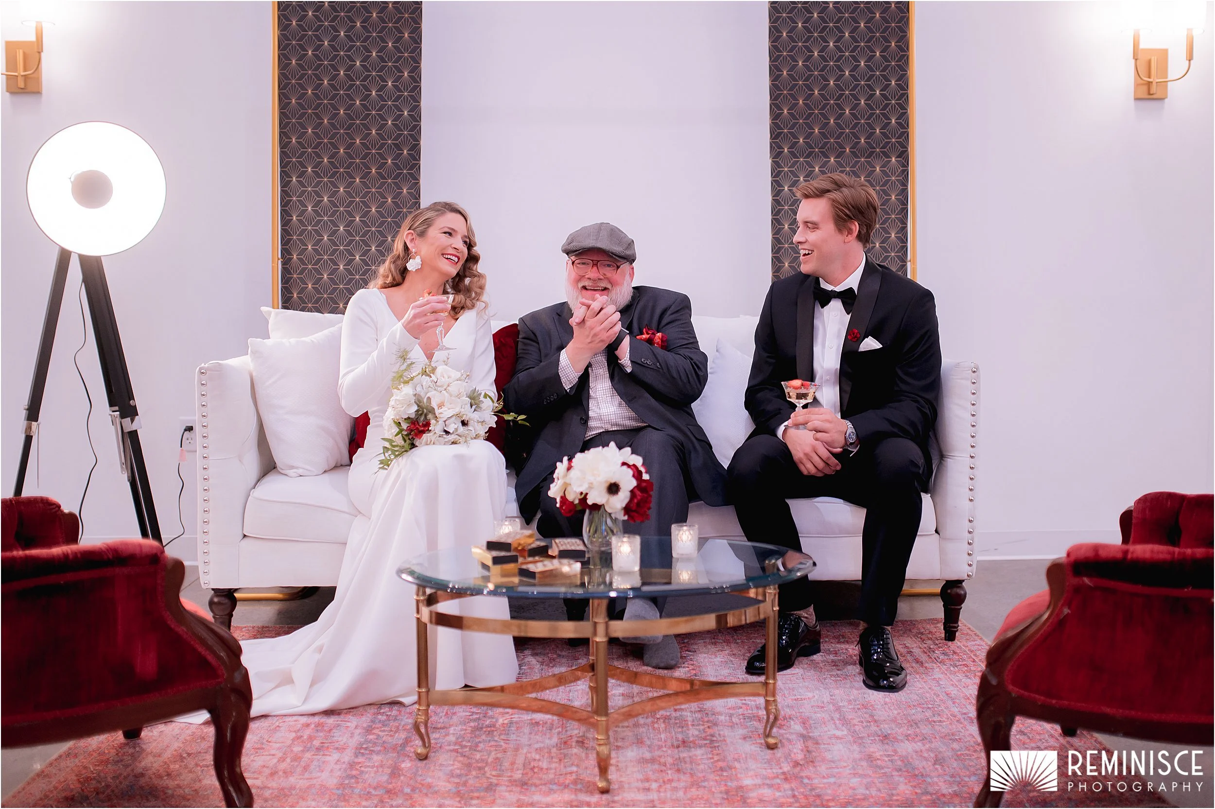 11-bride-groom-wedding-planner-seated-white-couch.JPG