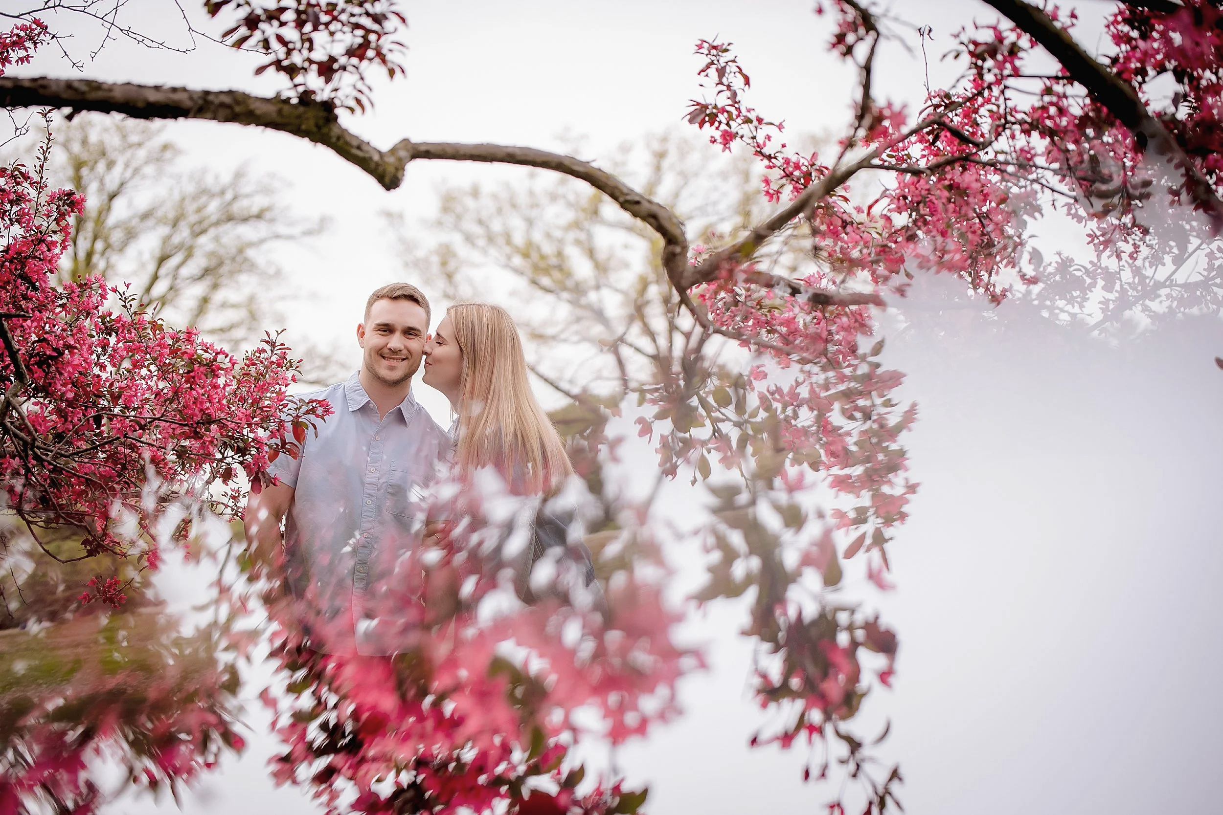 engaged-couple-double-exposure-spring-blooms.png