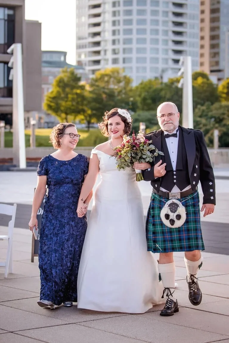 19-milwaukee-wedding-photography-ceremony-parents-walking-bride-aisle-kilt.jpg