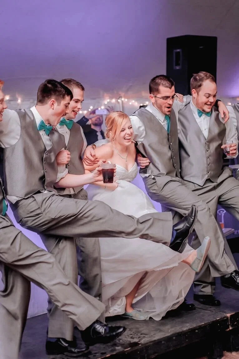 13-wedding-reception-photography-bride-dancing-groomsmen-kicking-canal-stree-yacht-club.jpg