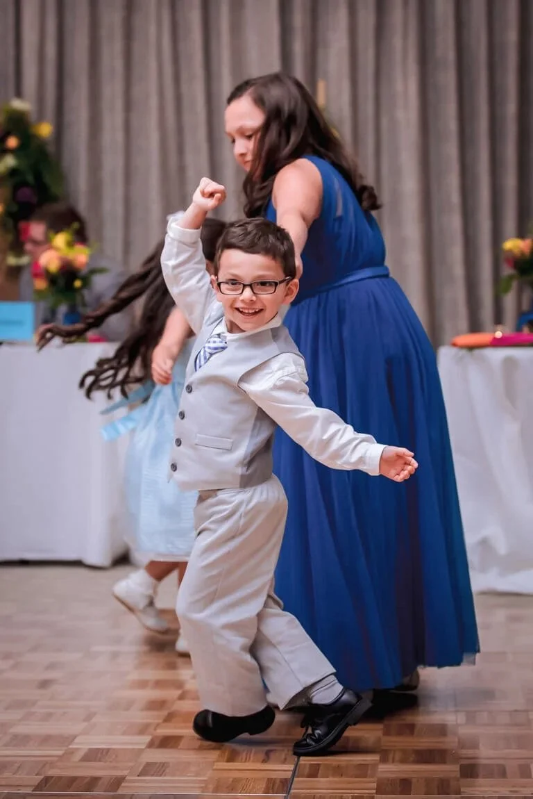 35-wedding-reception-photography-ring-bearer-dancing.jpg