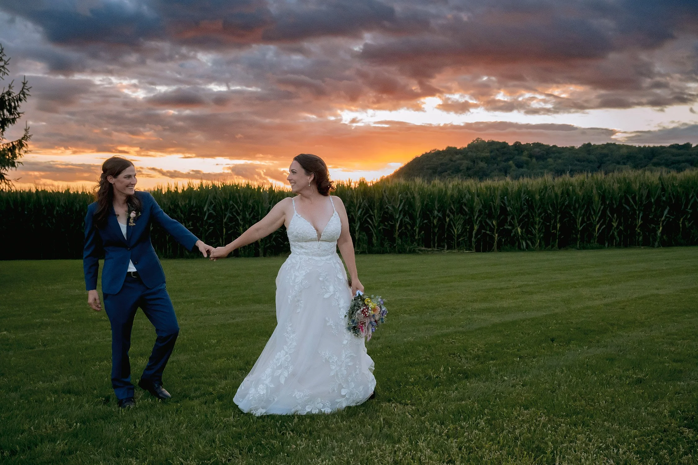 0005reminisce-milwaukee-wi-photographer-farm-lgbtq-wedding-sunset-holding-hands.jpg