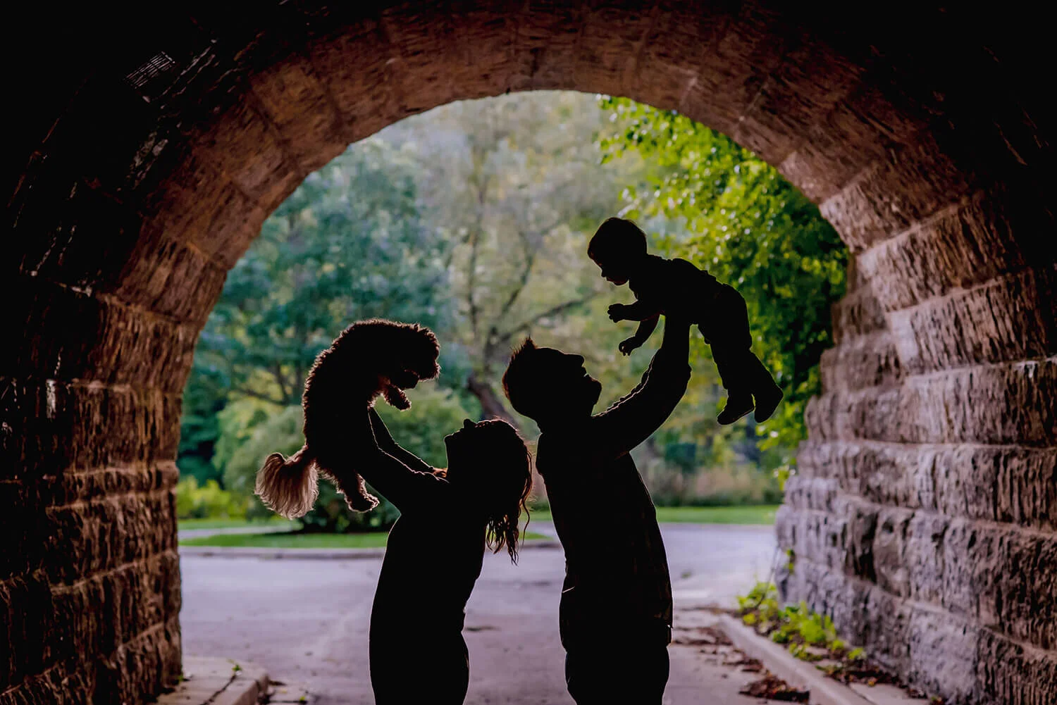 family-portrait-baby-dog-under-bridge-milwaukee-parks