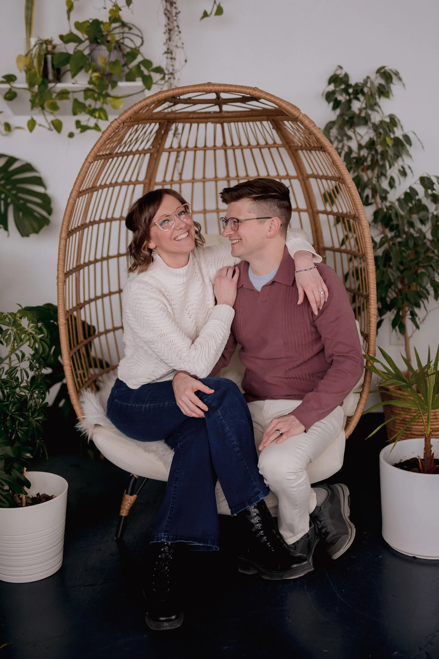 Milwaukee wedding photographers Miranda and Adam of Reminisce Photography sitting together  and laughing