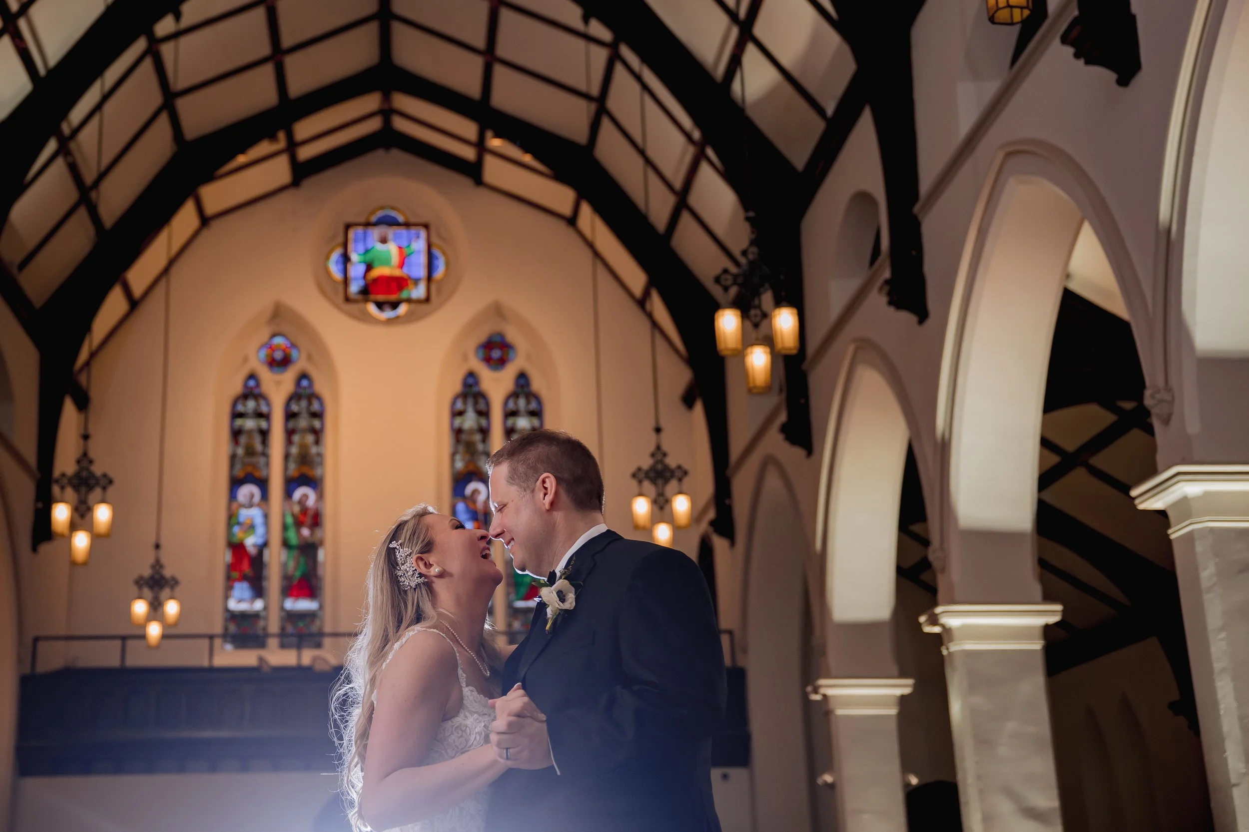 Bride and groom sharing first dance during wedding reception