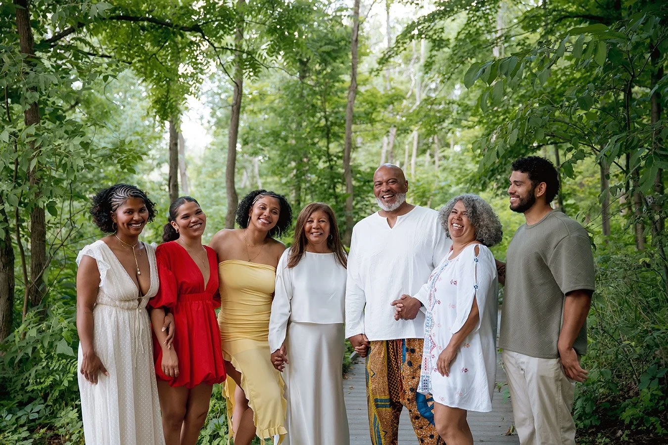 Milwaukee family photographer capturing an extended family portrait in a wooded outdoor setting at Wehr Nature Center at Whitnall Park