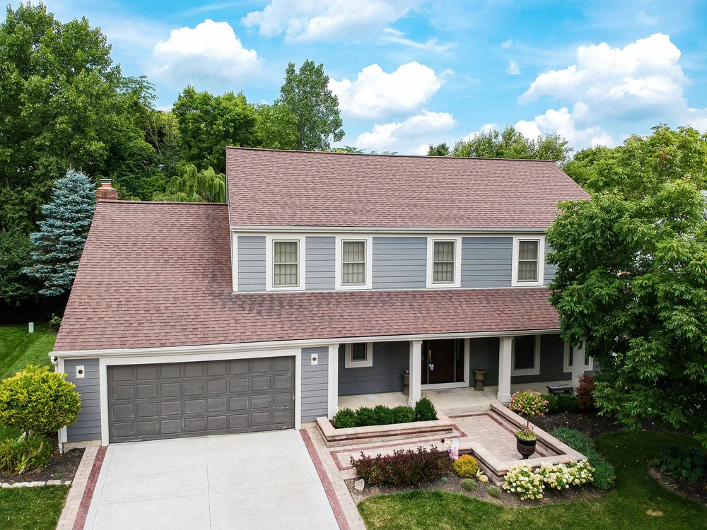 Front of a two-story home with finished siding and dormer, aerial photo, Columbus, Ohio
