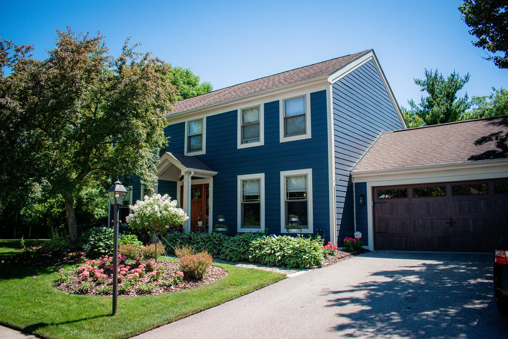 Completed blue lap siding home with attached garage in Columbus, Ohio