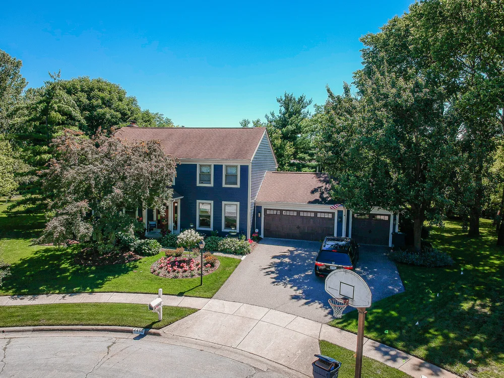 Aerial photo of a finished siding project on a home surrounded by trees in Central Ohio