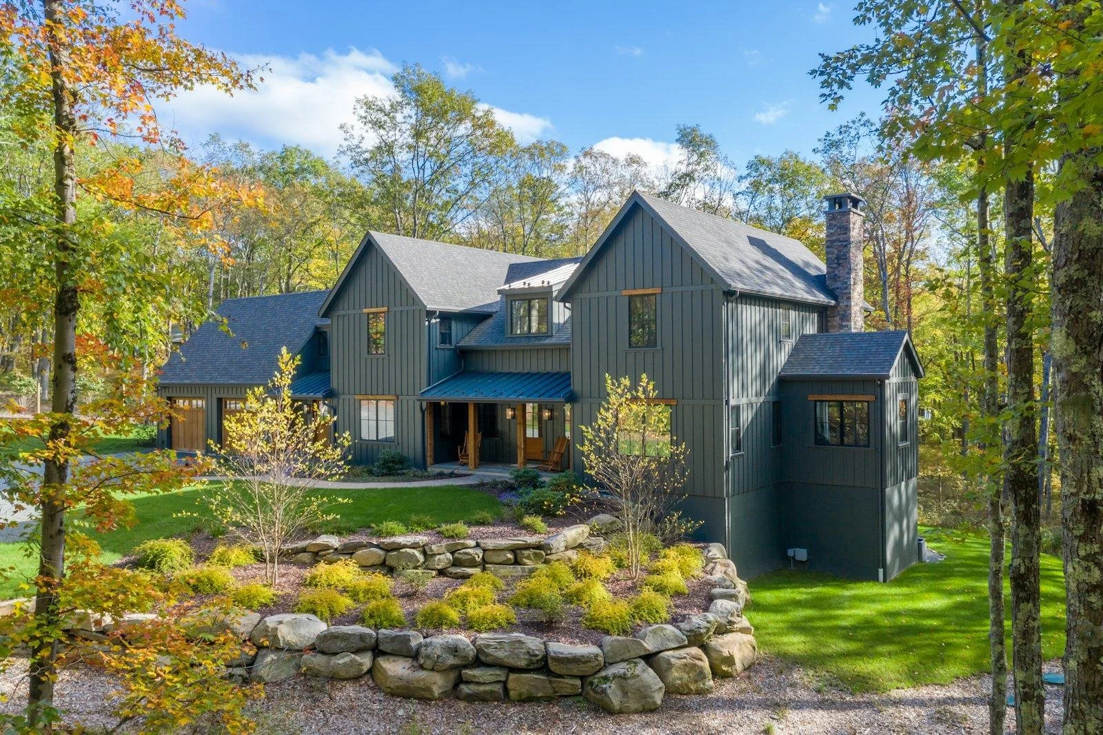 Dark gray James Hardie board and batten siding on a two-story home