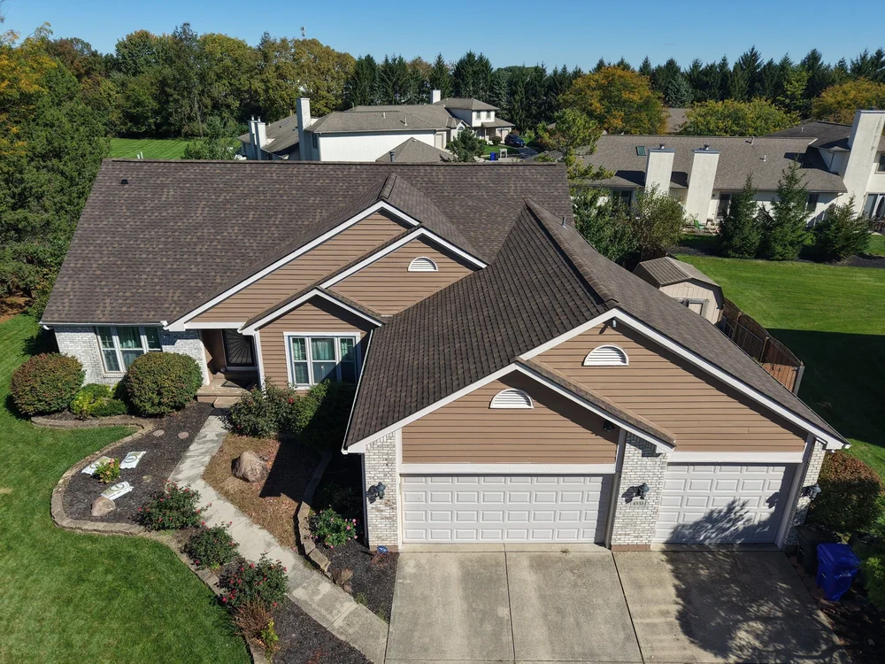 Front aerial view of a new brown shingle roof on a two-car-garage home in Columbus, Ohio