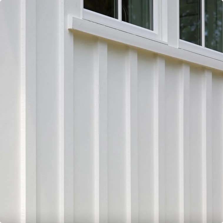 Close-up of white James Hardie trim battens below a window