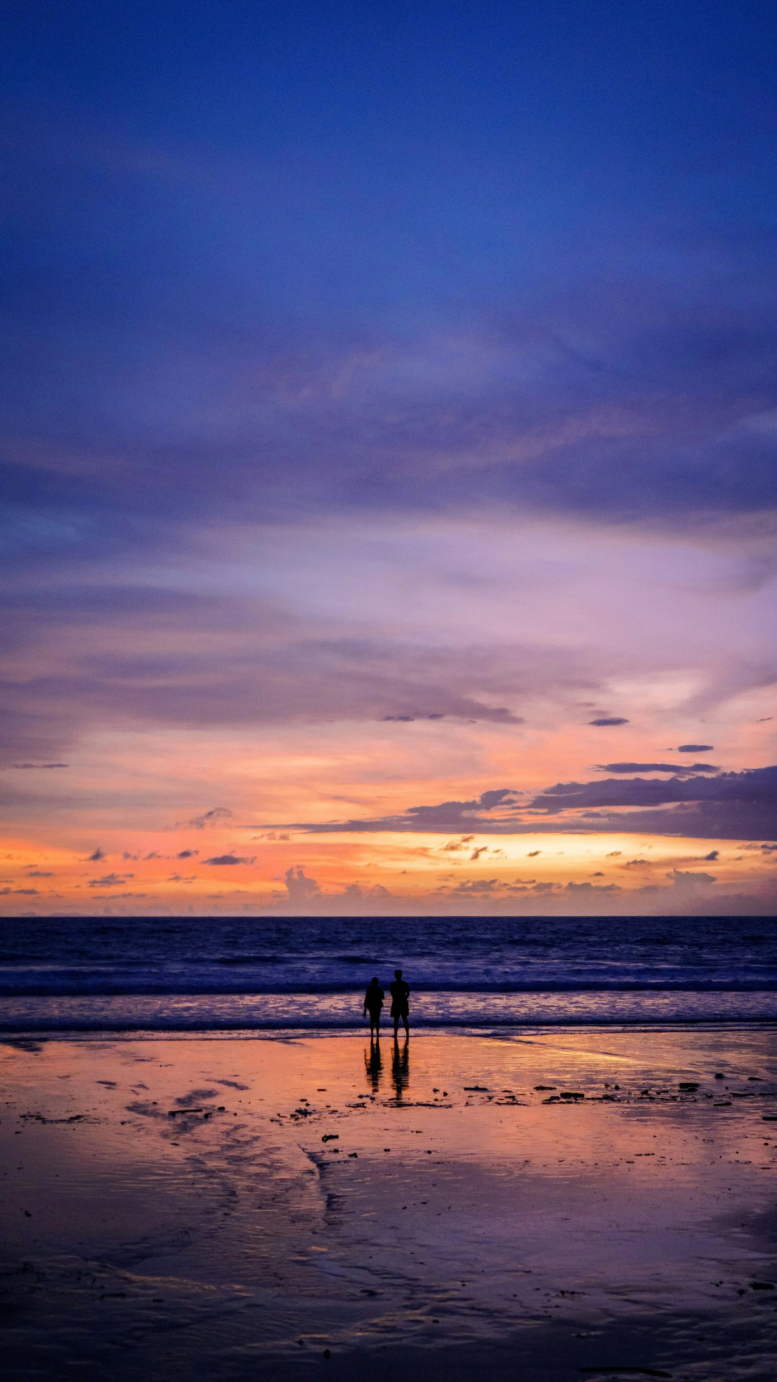 Couple on beach at sunset