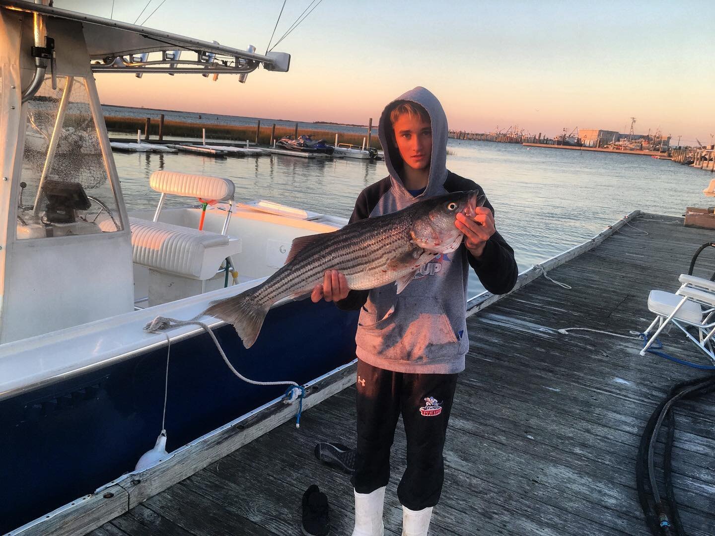 Here&rsquo;s @cole.kline with a perfect sized bass he caught in the inlet. #stripedbass