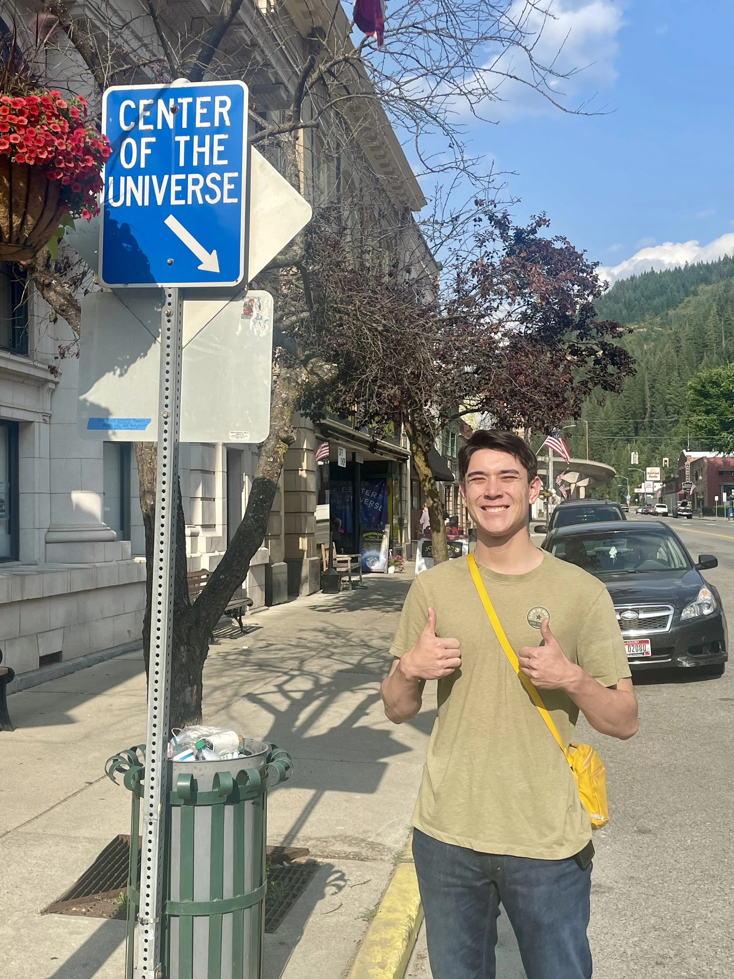 man smiling and putting 2 thumbs up