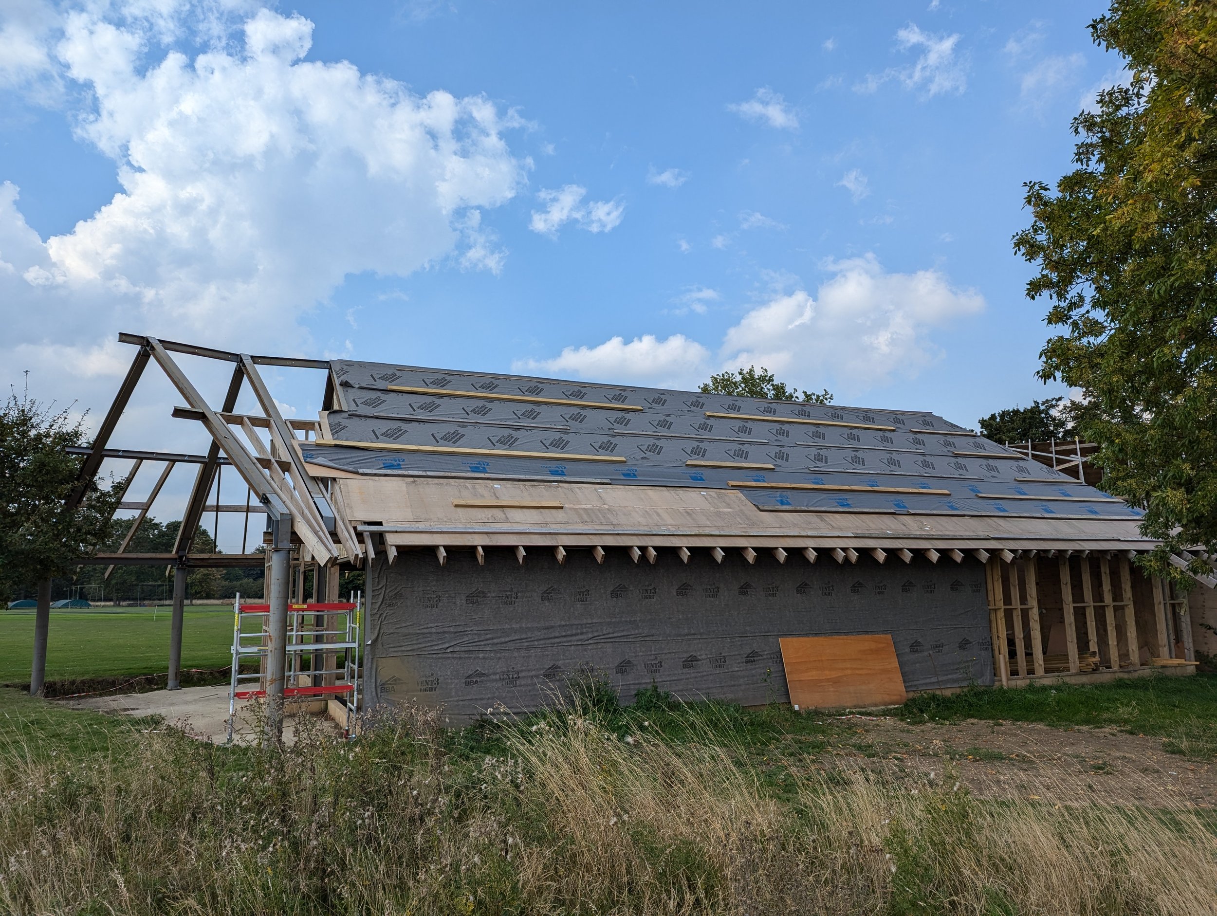 Roof being prepared for tiles  - view from field (April 2024)