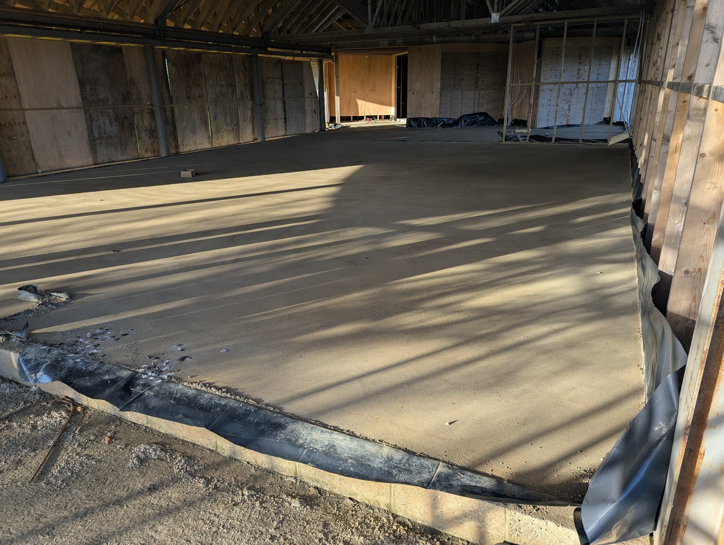 Screed poured in social area - view from field end (Dec 2025)
