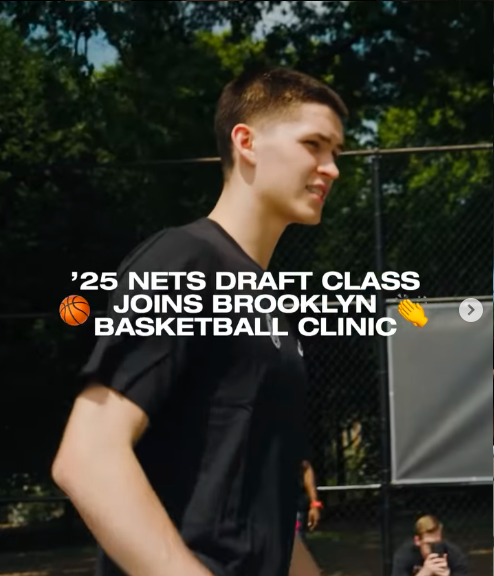Young man in a black shirt at a basketball clinic outside, with trees in the background, and text overlay about a '25 Nets Draft Class joining Brooklyn basketball clinic.
