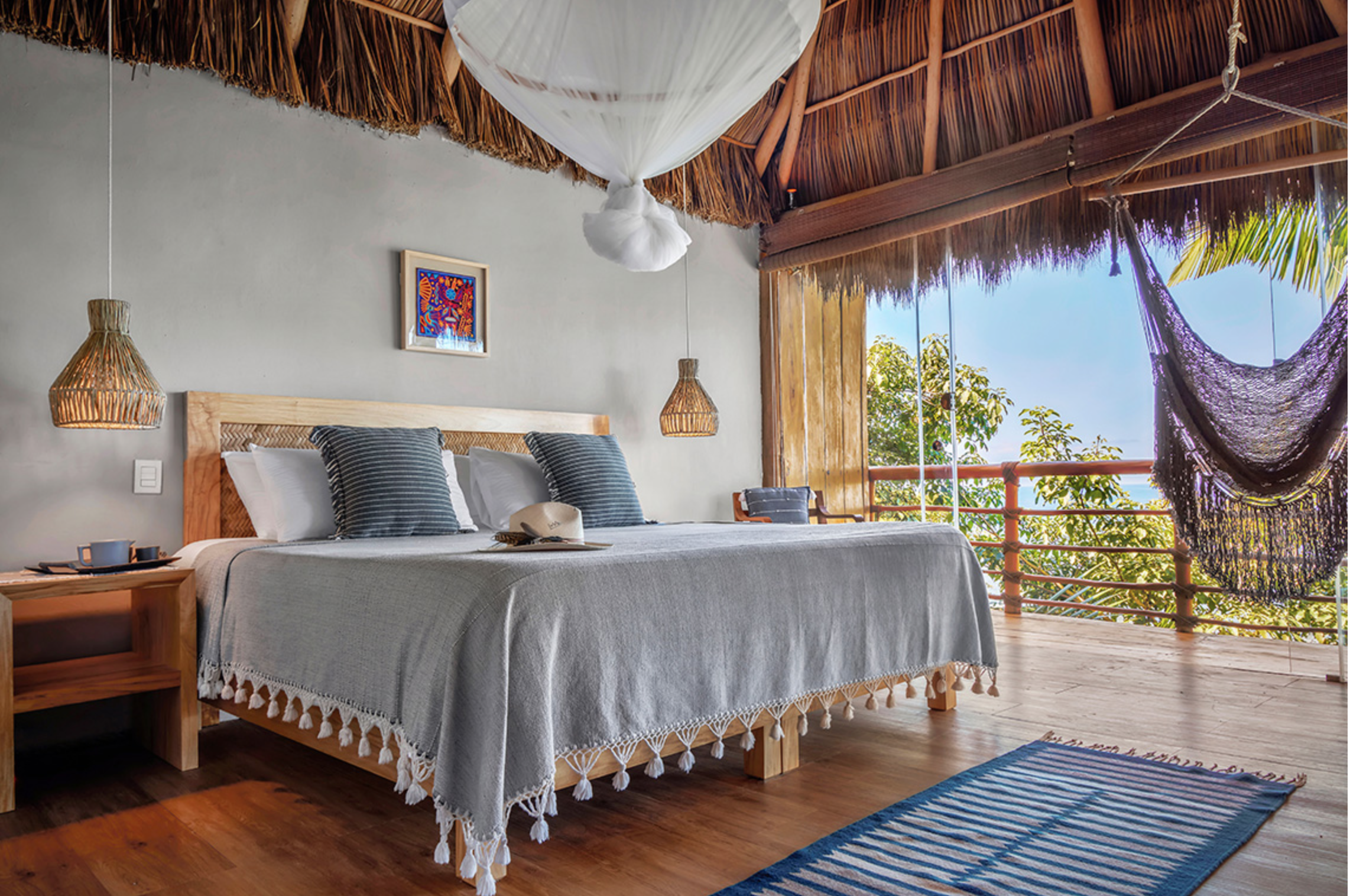 Xinalani Rooms Eco Chic ocean view spacious room with a king bed, hammock in the lush green jungle at Xinalani