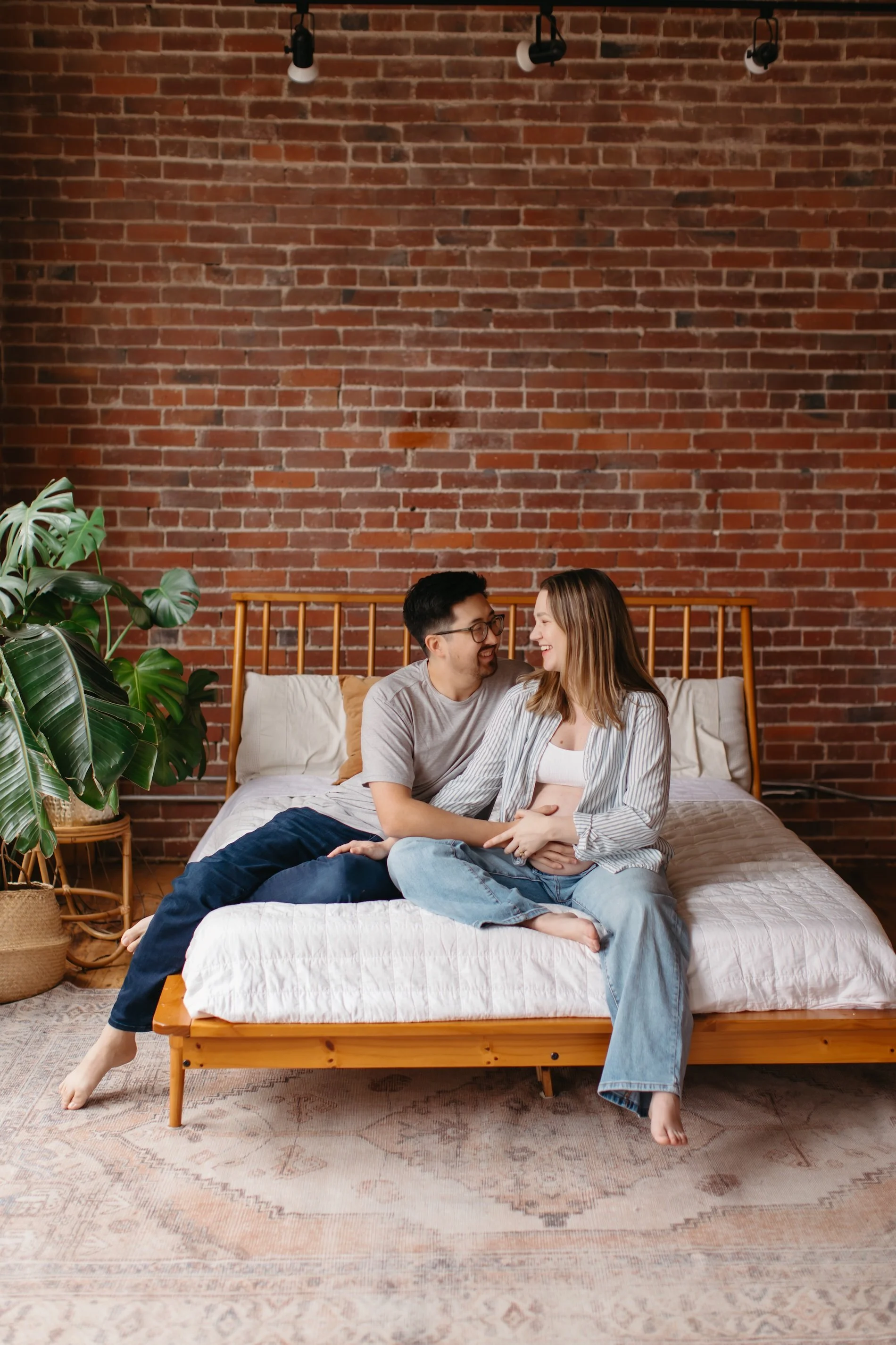 maternity studio session in Seattle of couple being tender