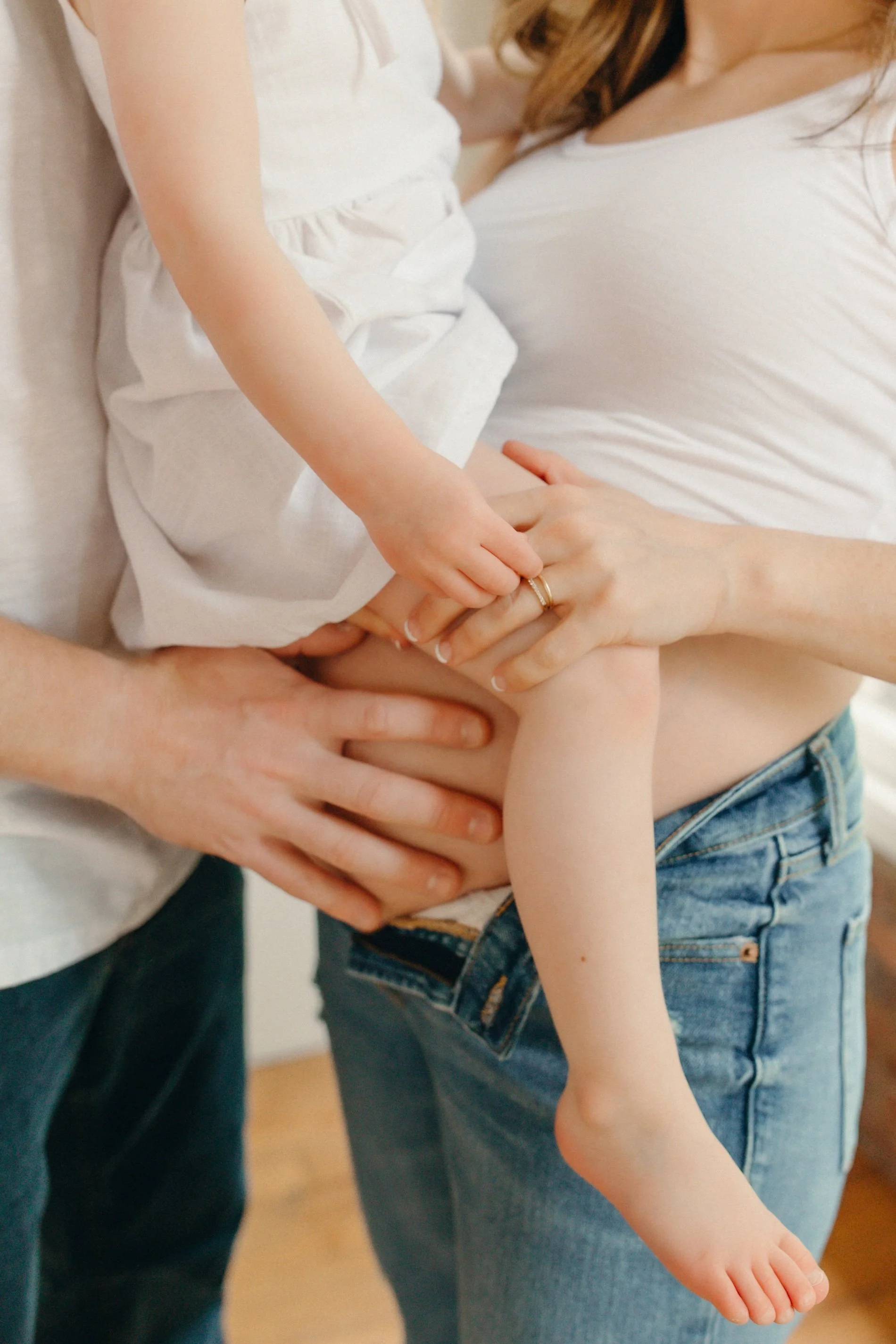 detailed photo of tender family celebrating pregnancy in seattle