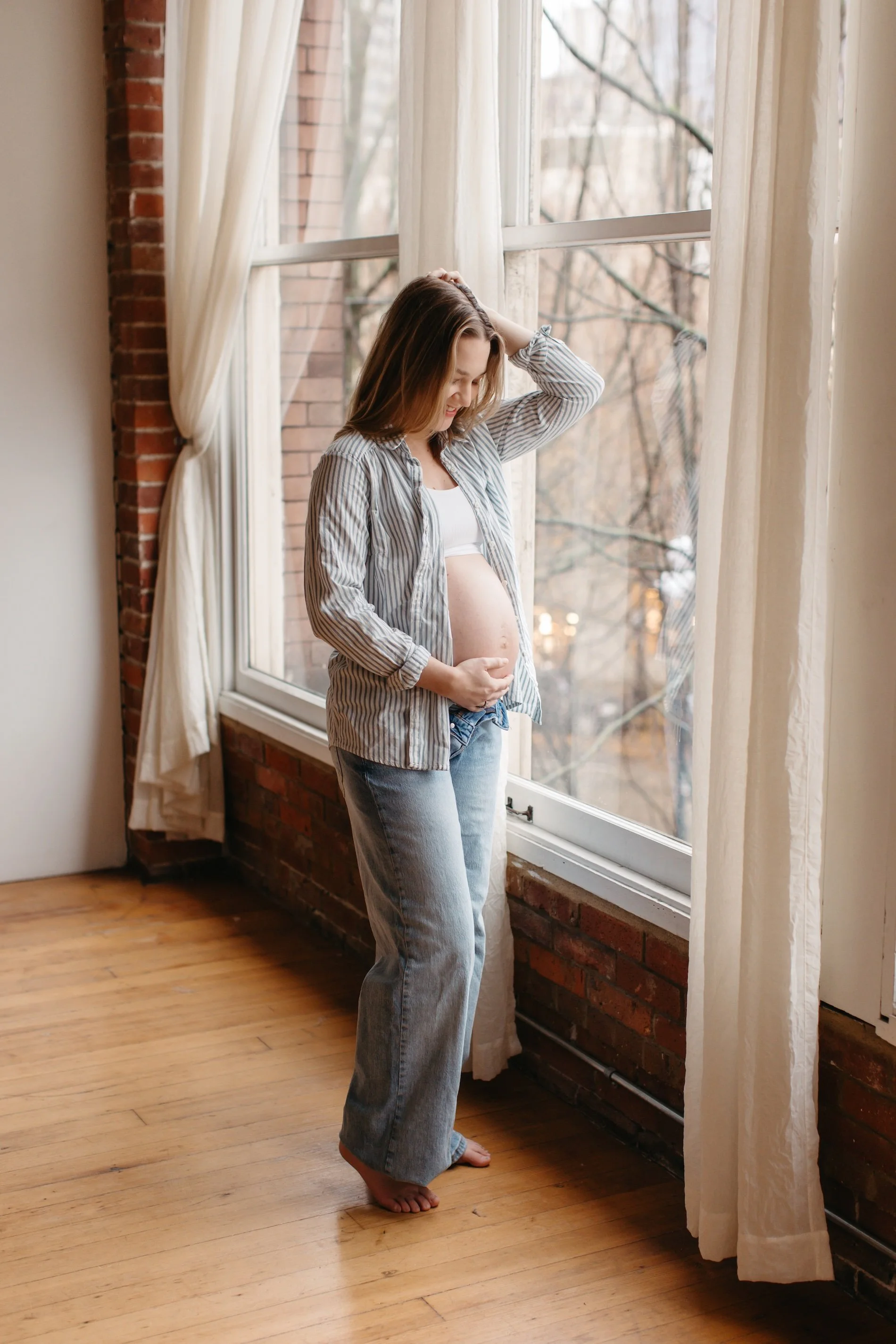 Bothell maternity session of mom holding growing belly