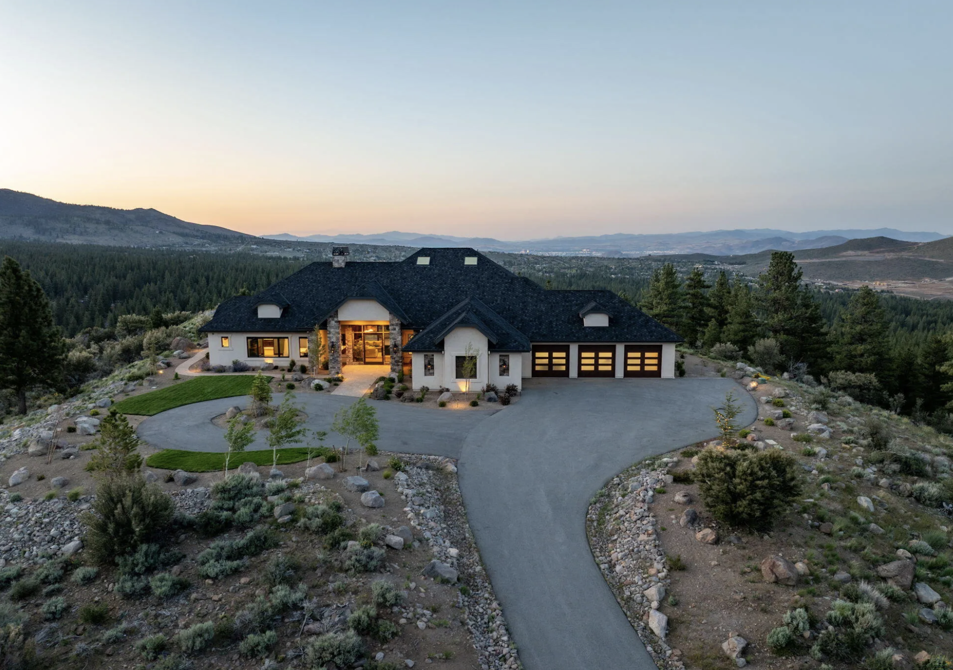 Aerial view of luxury estate home in St James Village Reno with mountain views