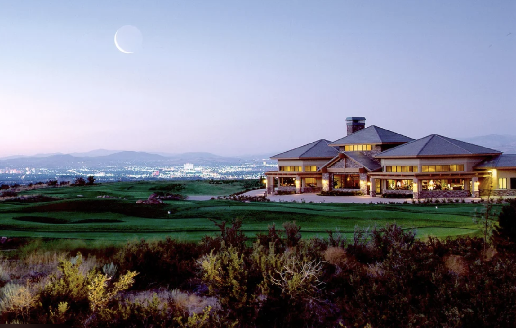 ArrowCreek clubhouse at twilight overlooking the Reno valley