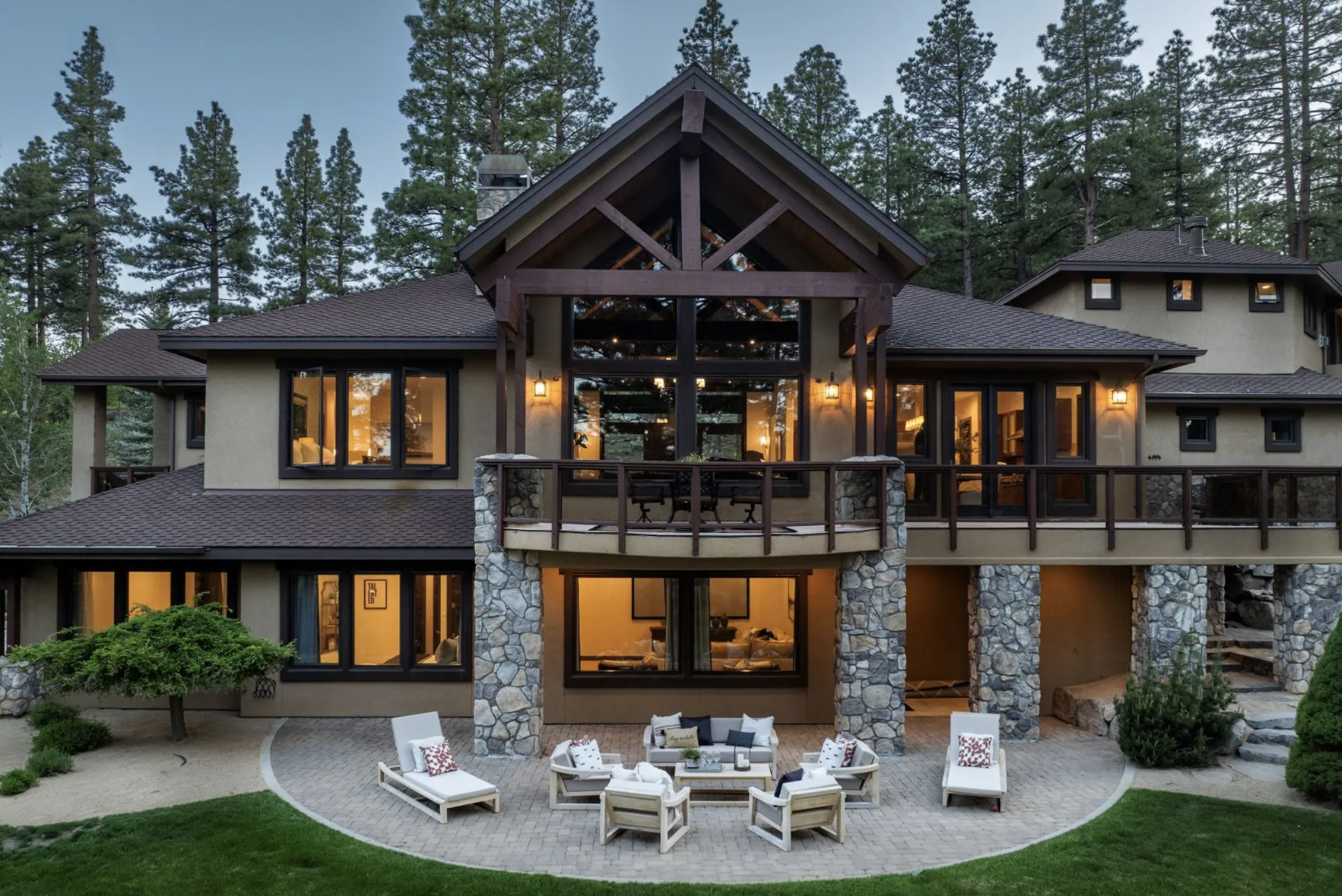 Custom luxury home in St James Village surrounded by tall pine trees