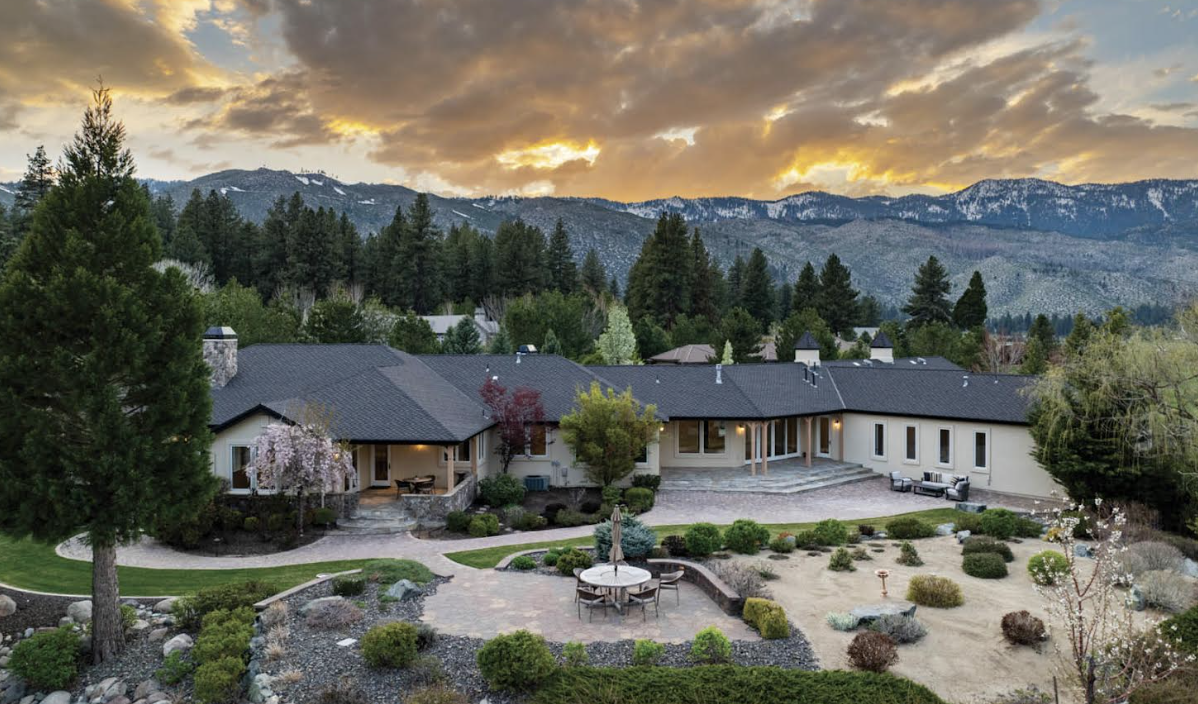 Aerial view of custom luxury home in Washoe Valley with Sierra mountain backdrop