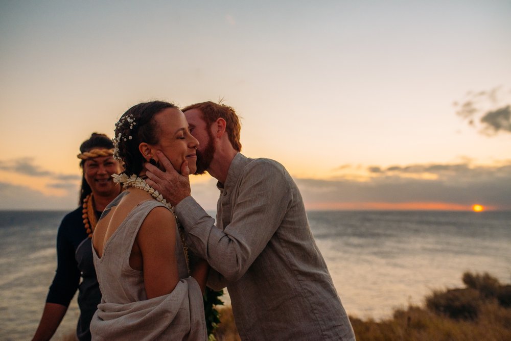 Big Island sunset wedding kiss