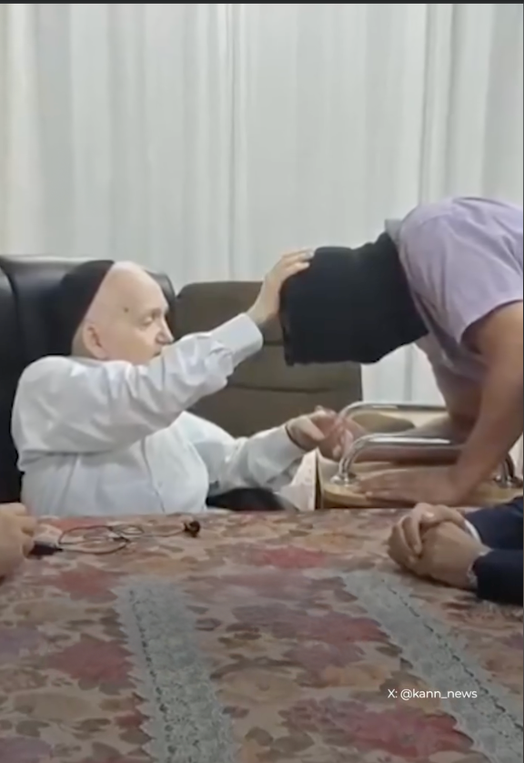   Rabbi Meir Mazuz places his hand in blessing on an Israeli soldier accused of abusing Palestinian detainees at Sde Teiman—sending a public message that even alleged torture is worthy of honor, not accountability.  