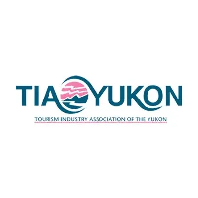 Logo of the Tourism Industry Association of the Yukon with stylized landscape and text.