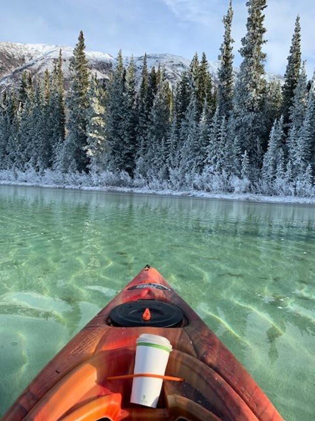 Kayaking Emerald lake when it was a little bit frozen around the shore, with my Caribou Crossing Coffee
