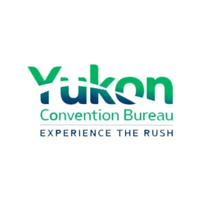 Yukon Convention Bureau logo with green and blue text and the slogan 'Experience the Rush'.