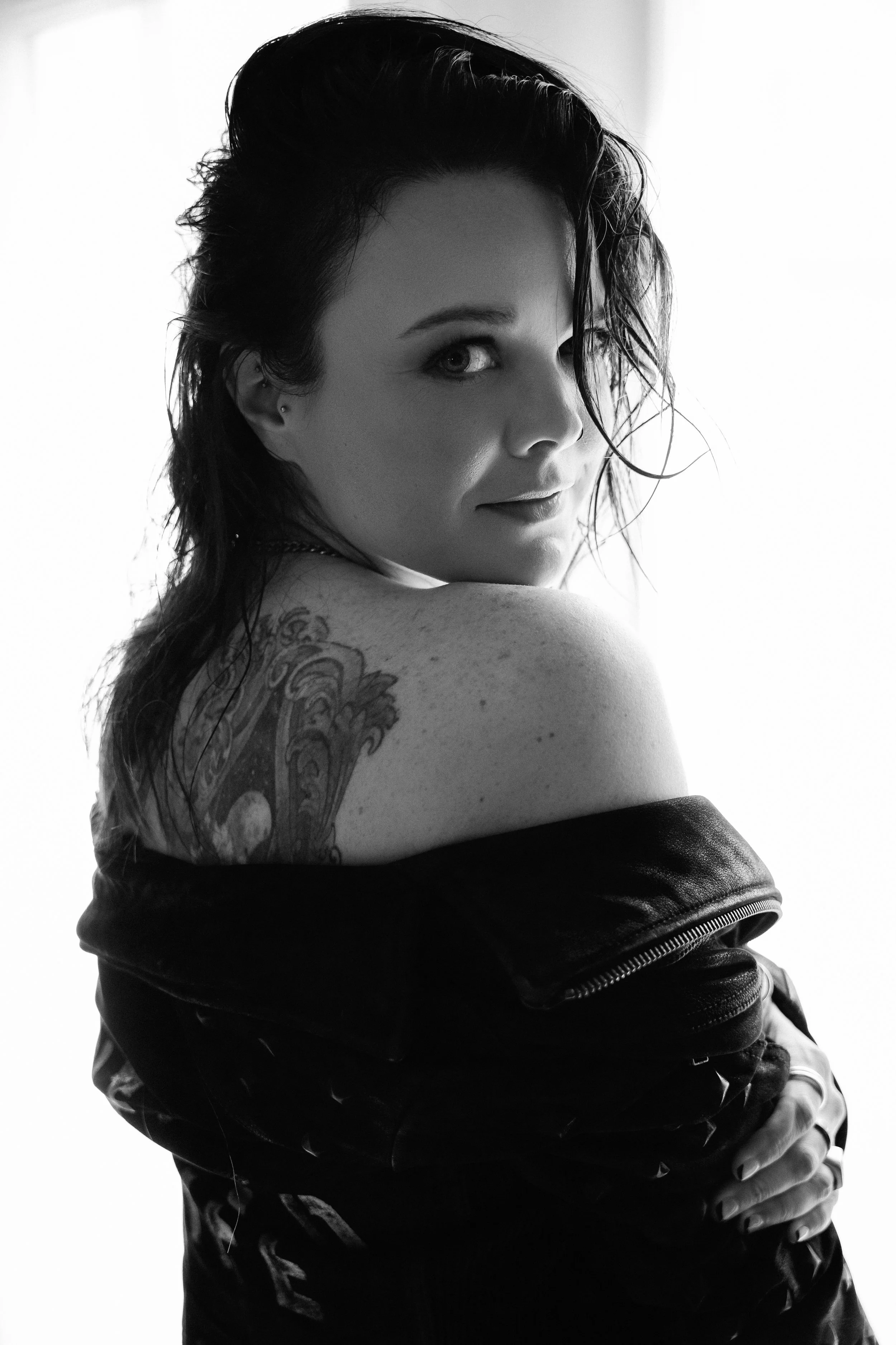 Black and White boudoir photography taken at Chrissy René Studios. Signature mini sessions include digitals and polaroids in a genuine leather envelope perfect for gifting.