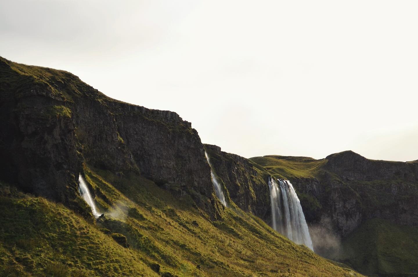 Waterfalls send their magical mist across the greenery of Iceland in one of my favorite shots on this island.

12 days in Iceland and we hit nowhere near the amount of waterfalls that were on my bucketlist. I can't wait to go back and see what other 