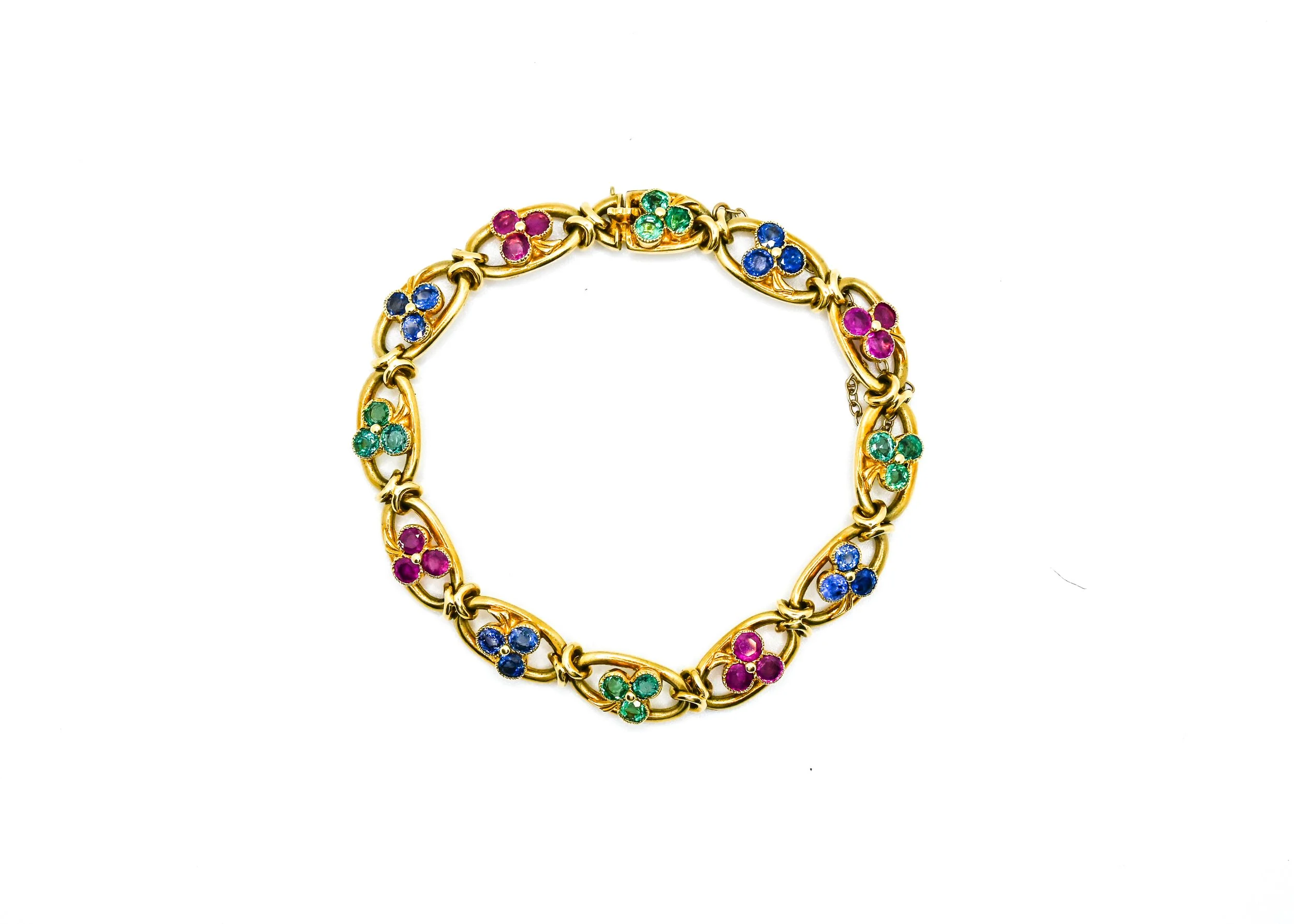 Gold chain necklace with colorful flower-shaped gemstone accents