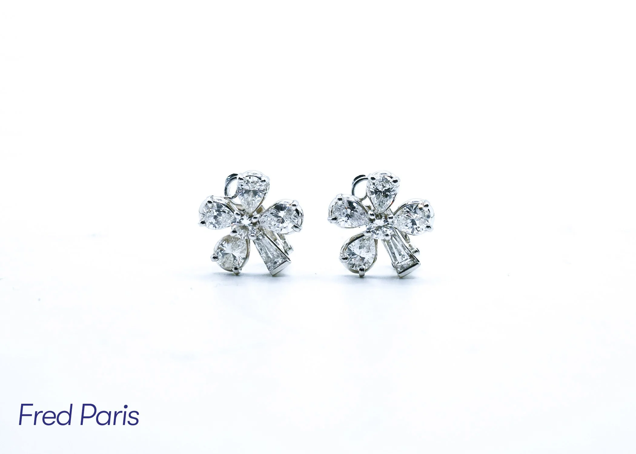 Pair of diamond butterfly-shaped earrings with clear stones, displayed on a white background.