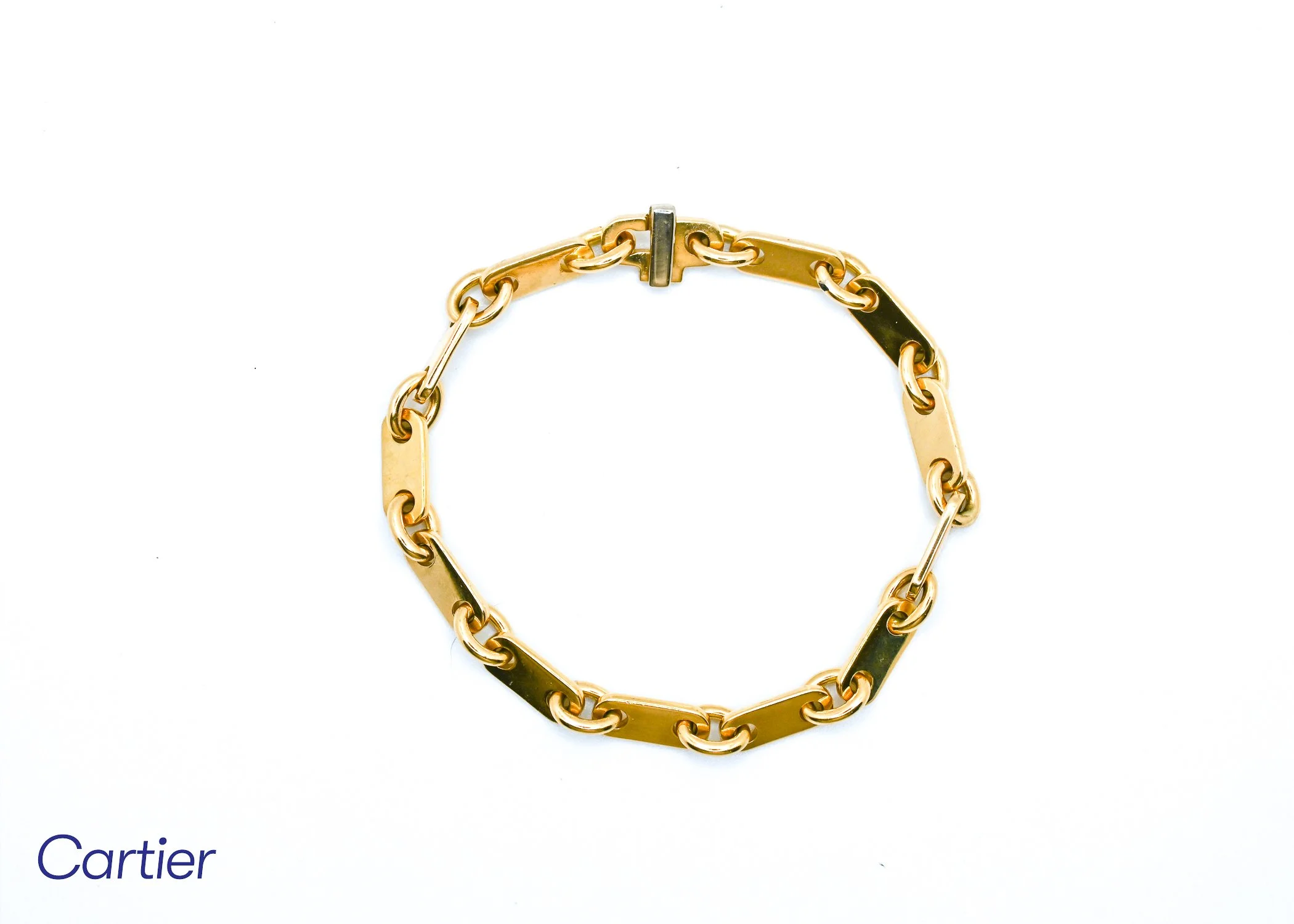 Gold Cartier chain bracelet displayed on white background