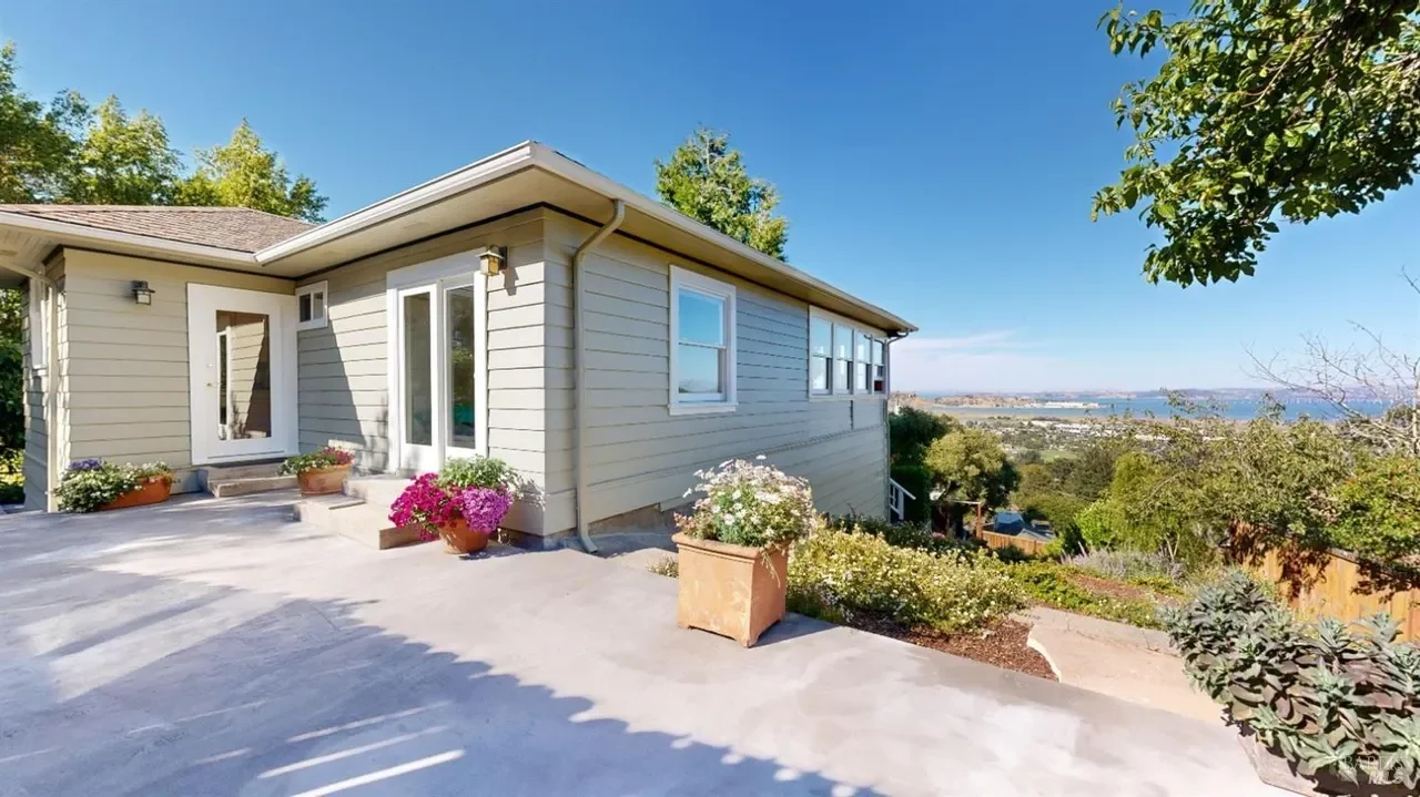This vintage home on the of Christmas Tree Hill in Corte Madera has amazing city views and beautiful wood flooring and solid cut redwood making it fire termite resistant, great schools too!