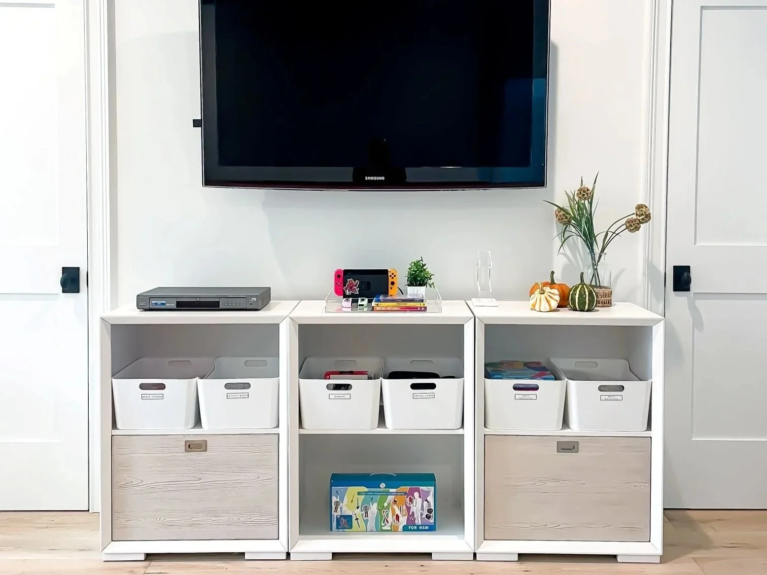 bright living room with an organized console under the TV