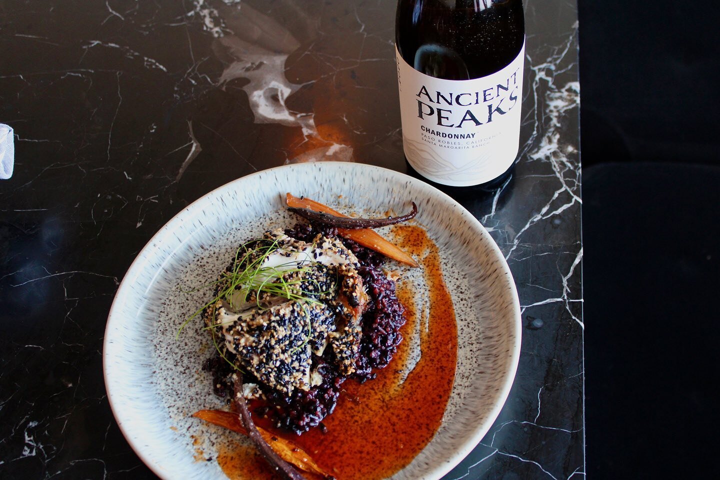 Sesame Crusted Goldentile -
Miso glazed carrots - forbidden rice- F I R E C R A C K E R sauce 🎇 

We are bringing in a whole bunch of new wine like this Ancient Peaks Chardonnay 😍

#foodnwine #goldentile #sweetnspicy #misoglaze #seafood #local #fin