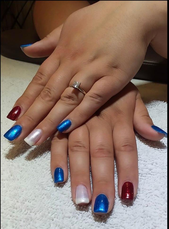 Free-hand sculpted acrylic nails polished red, white, and blue, for 4th of July