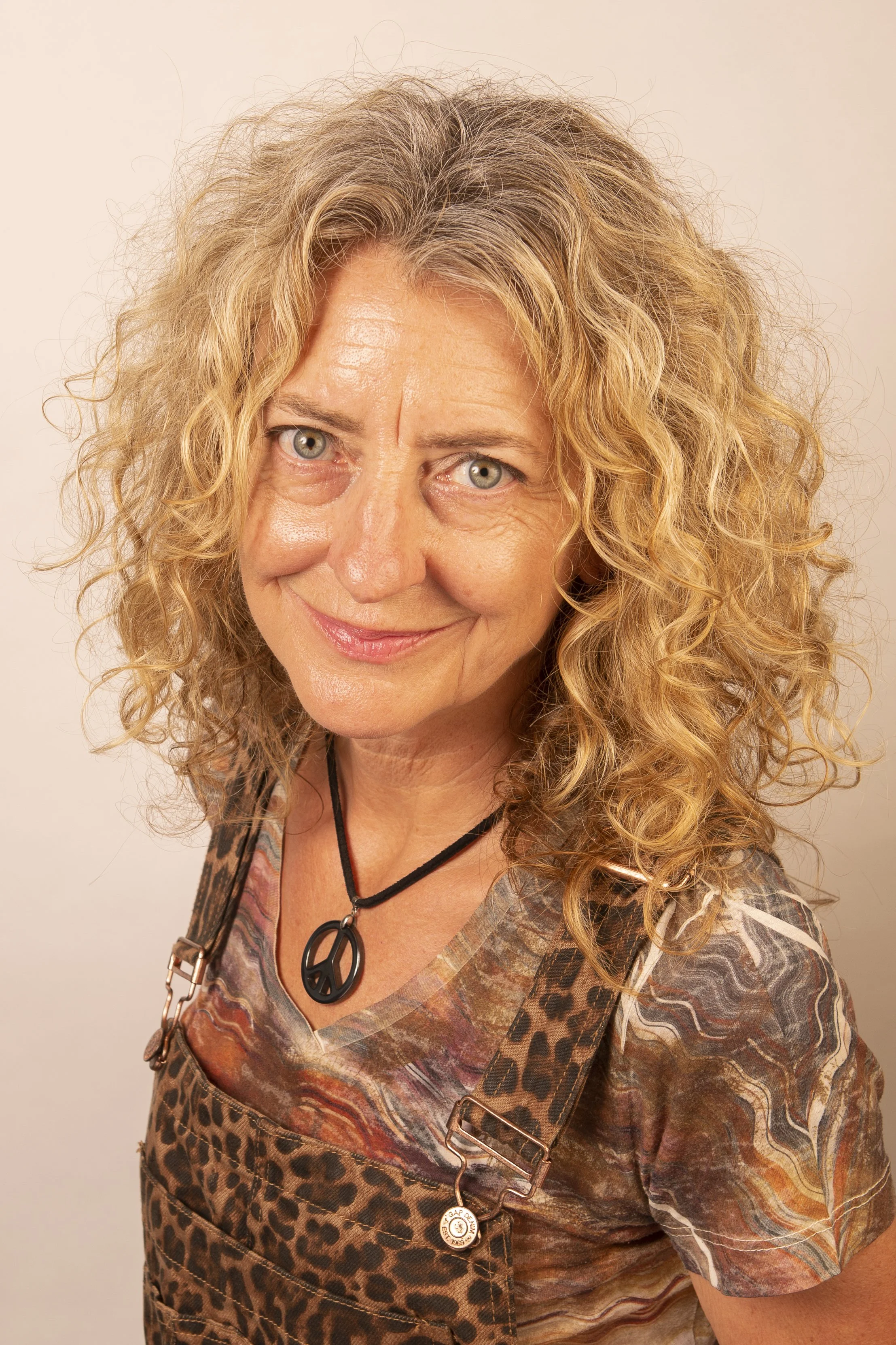 Pam Voth stand up comedian headshot leopard overalls_72dpi.jpg
