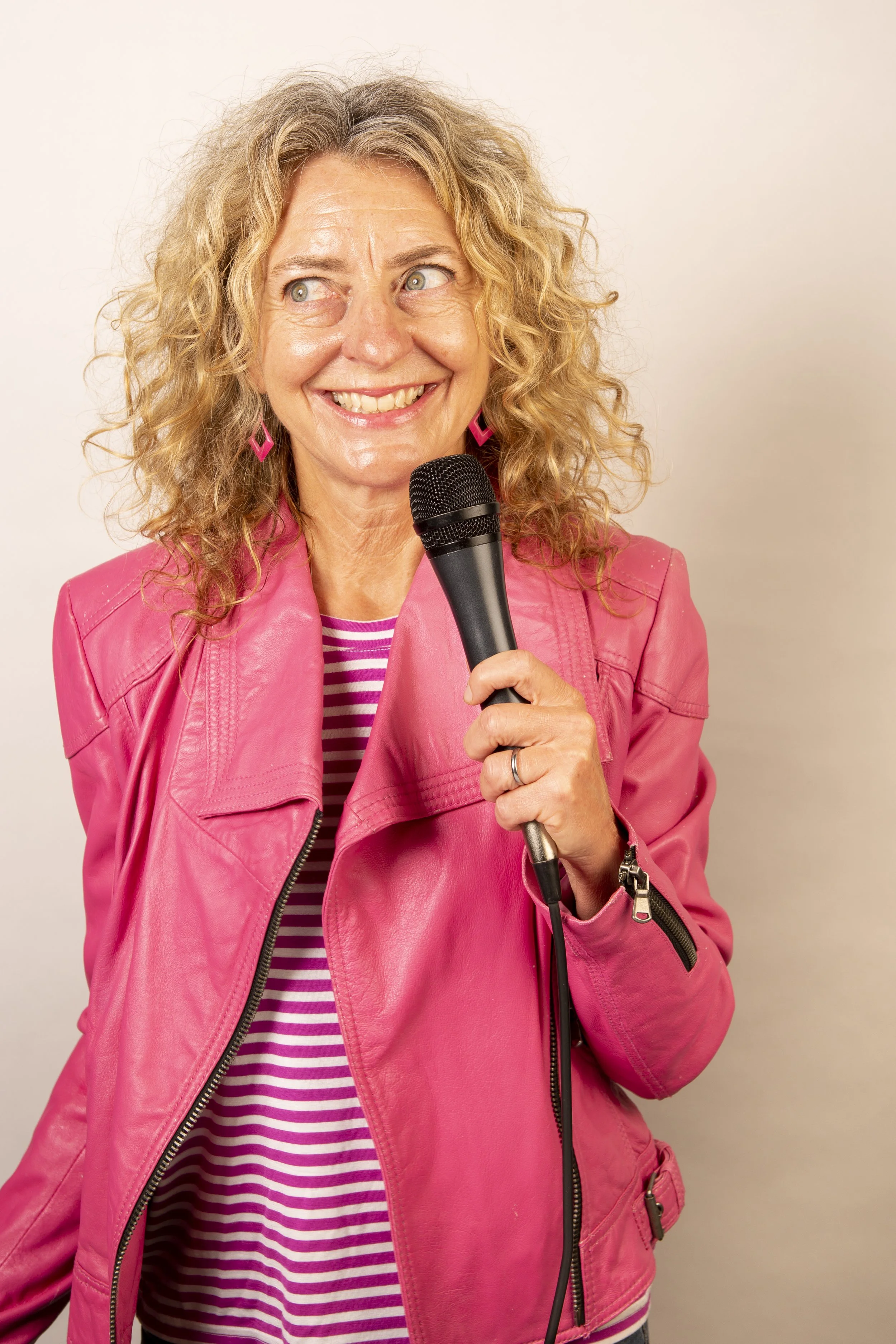 Pam Voth stand up comedian mic pink leather jkt_72dpi.jpg