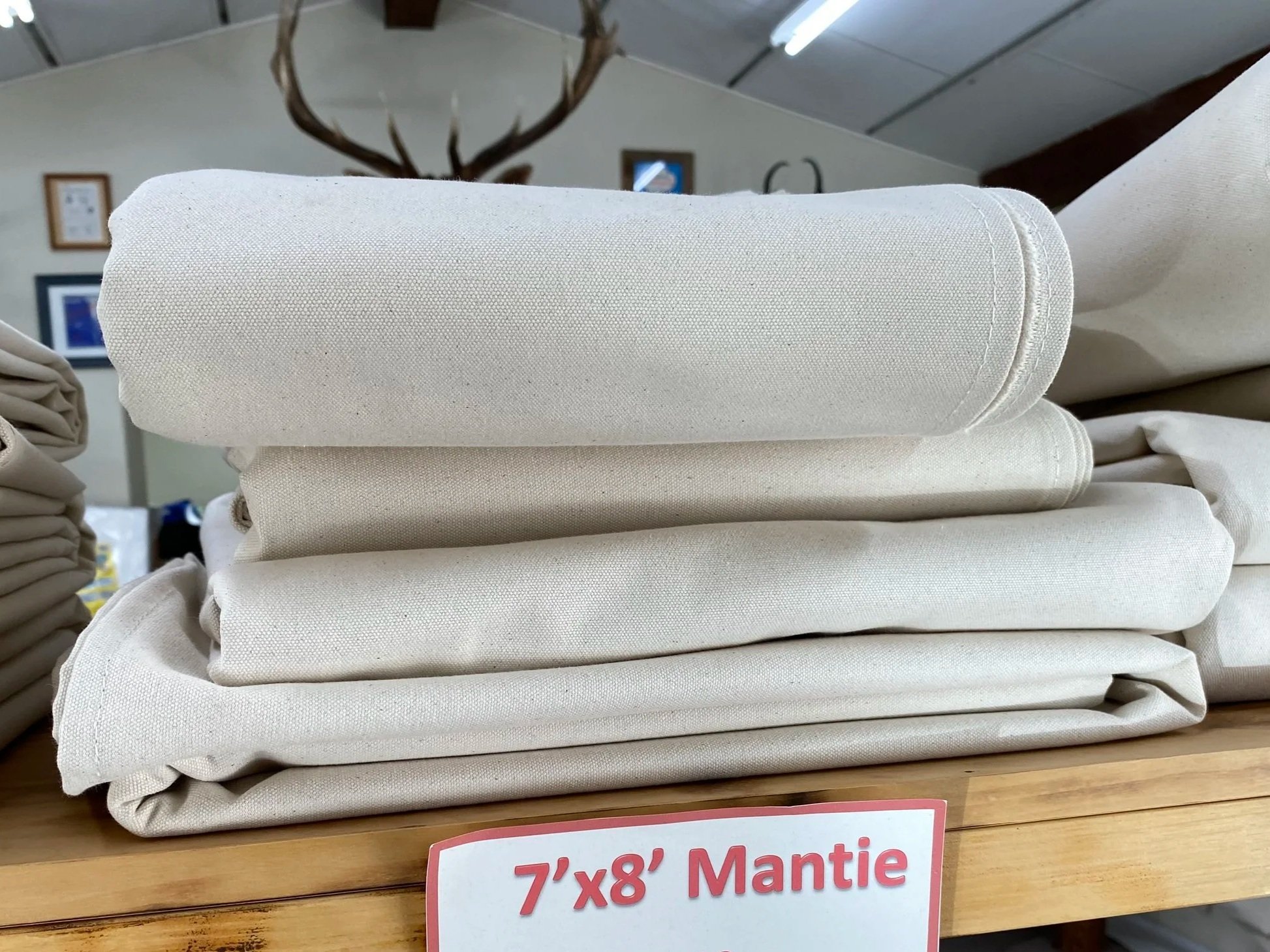 7'X8' MANTIE
Made out of 15 oz canvas and double hemmed around outside edges.