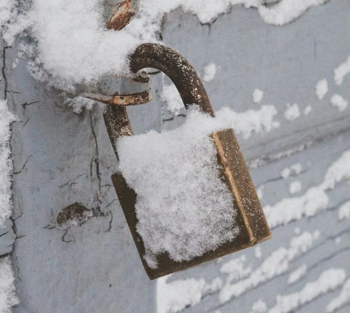 A padlock covered in snow